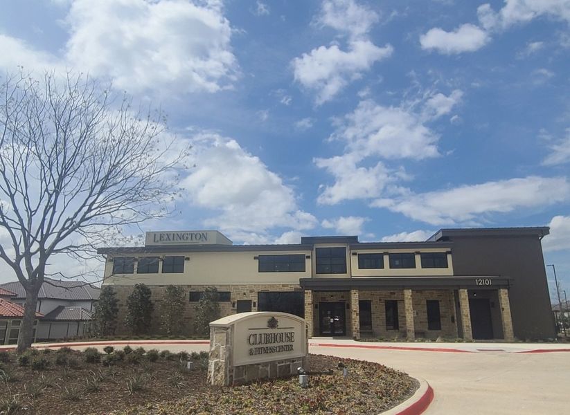 A modern clubhouse with stone accents and landscaping in Symmetry 37s by Landon Homes (Frisco, TX).