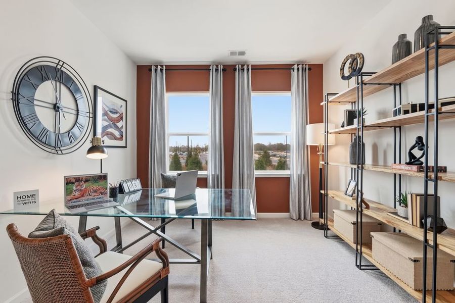 Furnished interior in a model home at Terraces at the Exchange in Indian Land (Image 5).
