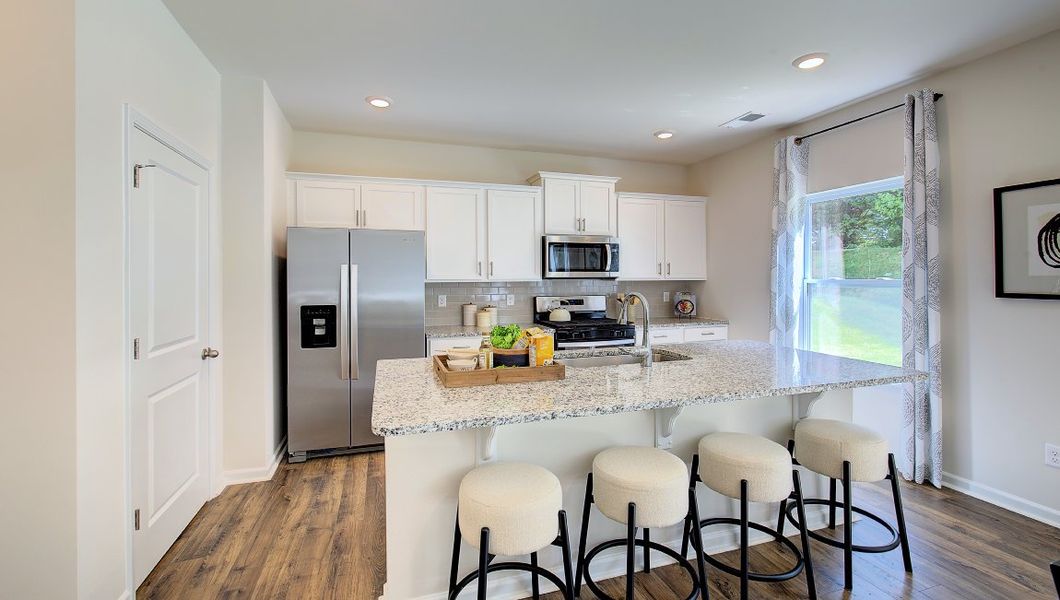 Furnished interior in a model home at Heritage Park in Fletcher (Image 9).