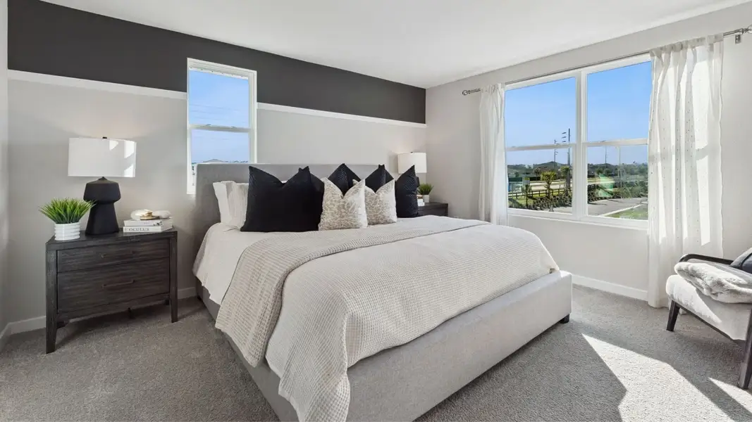 Furnished interior in a model home at Fish Lake Cove in Kissimmee (Image 6).