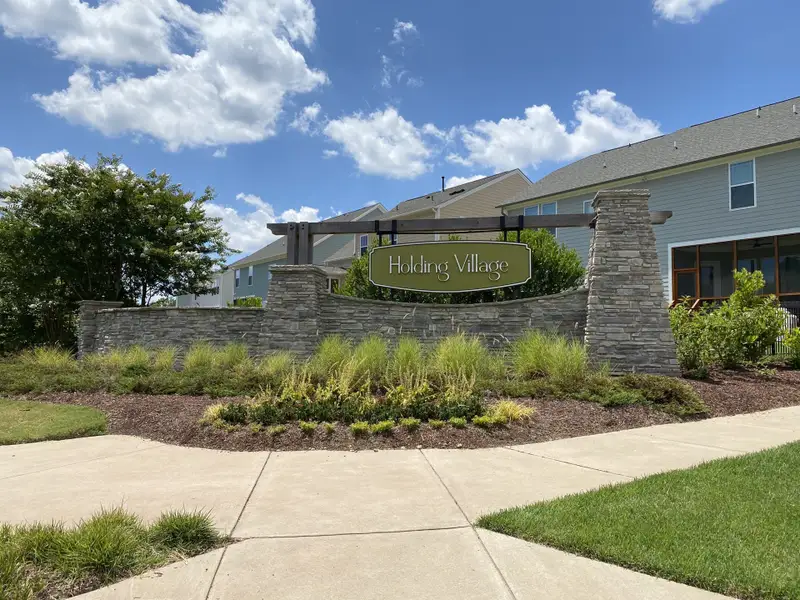 Entrance to the Holding Village community in Wake Forest, NC, featuring signage and landscaping (Image 1). Entrance to the Holding Village community in Wake Forest, NC, featuring signage and landscaping (Image 1).