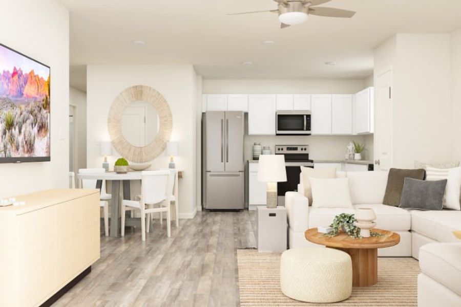 A large living room with white furniture.