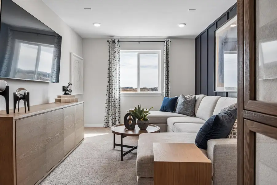 A living room with a couch and a table.