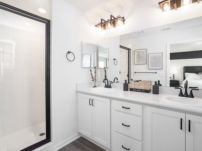 Your suite is complete with a walk-in wardrobe and a large en-suite bath - Aria model home in St. Cloud, FL