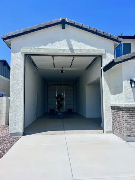 Expansive garage space in Laveen Vistas II by Homes by Towne, featuring modern design in Phoenix, AZ. Expansive garage space in Laveen Vistas II by Homes by Towne, featuring modern design in Phoenix, AZ.