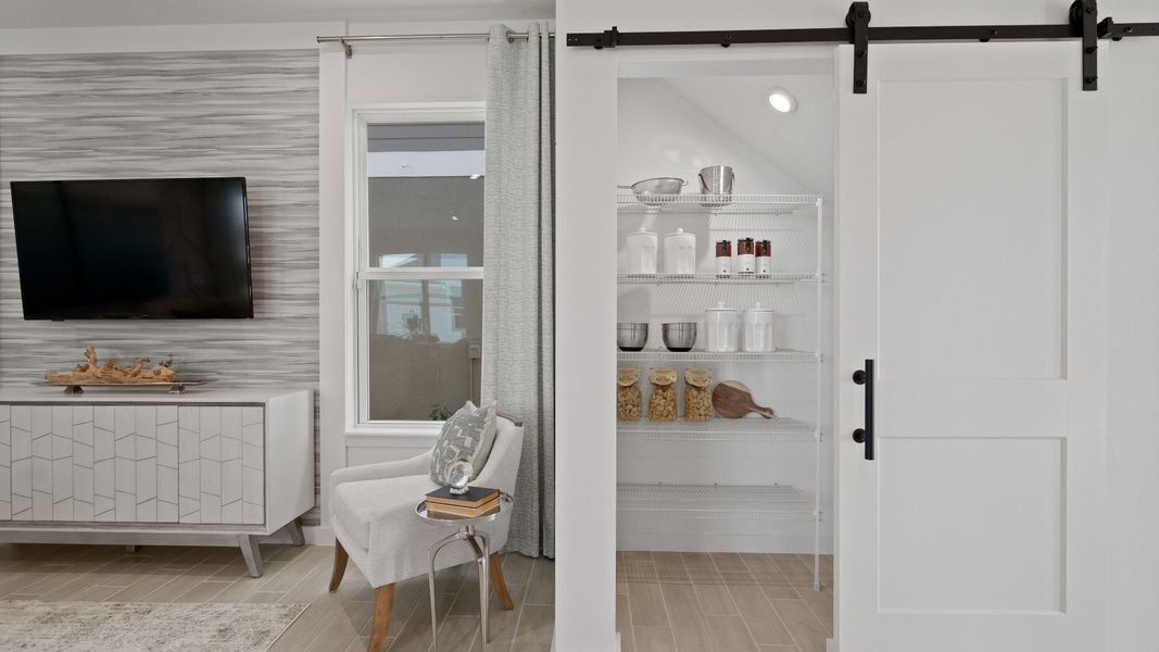 Trinity Place Staged Model Ambersweet Living Area and Pantry Space by DRB Homes in Saint Cloud FL Trinity Place Staged Model Ambersweet Living Area and Pantry Space by DRB Homes in Saint Cloud FL