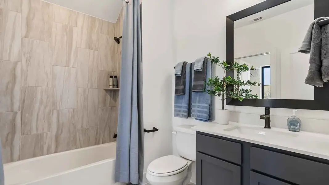 Furnished interior in a model home at The Ridge at Tamarron in Fulshear (Image 13).