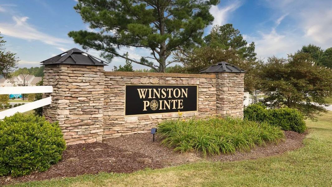 Entrance to the The Grove at Winston Pointe community in Clayton, NC, featuring signage and landscaping (Image 1). Entrance to the The Grove at Winston Pointe community in Clayton, NC, featuring signage and landscaping (Image 1).