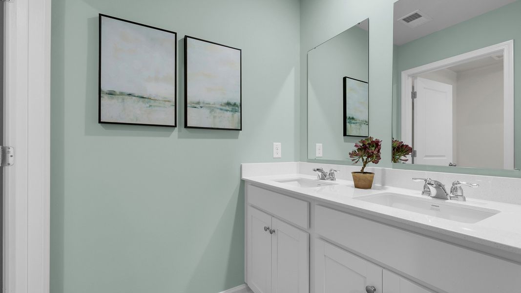 Furnished interior in a model home at The Cove at Mallard Crossing in Summerville (Image 28).