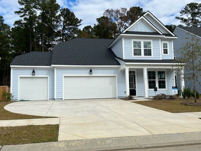A charming two-story home with a spacious driveway in Enclave at South Pointe Estates by DRB Homes (Summerville, SC).