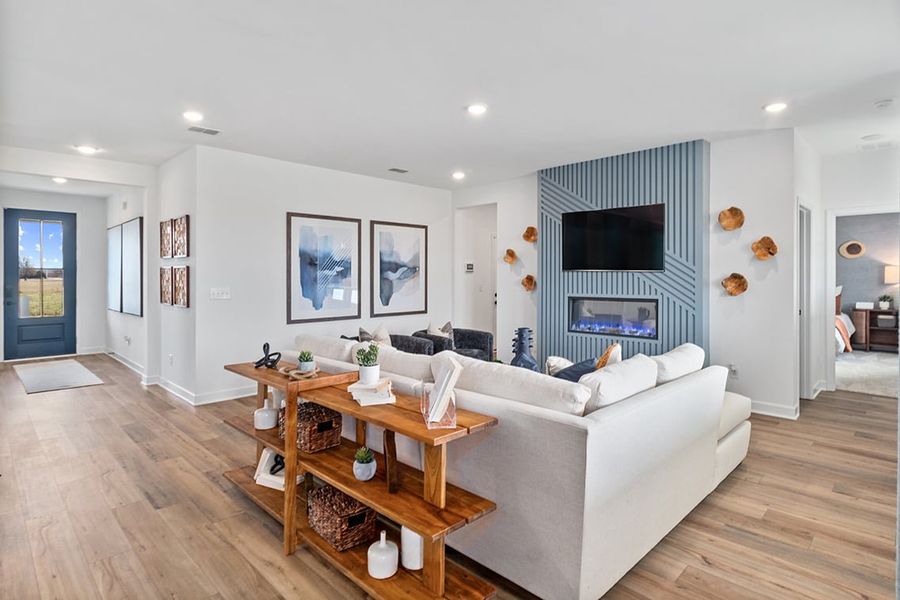 A living room with a large white couch. A living room with a large white couch.