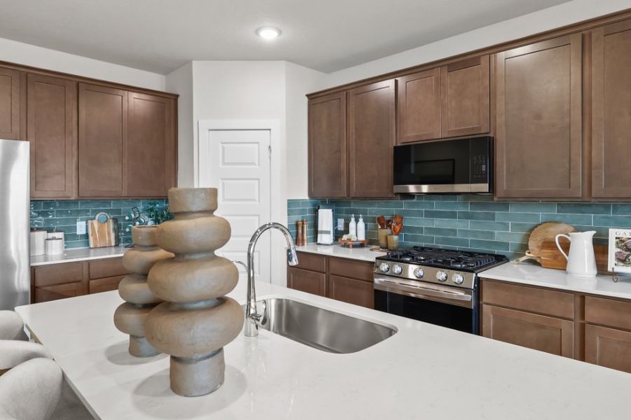 A kitchen with wooden cabinets. A kitchen with wooden cabinets.