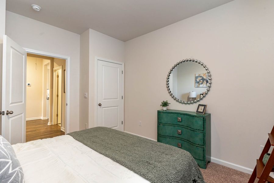 Furnished interior in a model home at Island Green in Myrtle Beach (Image 52).