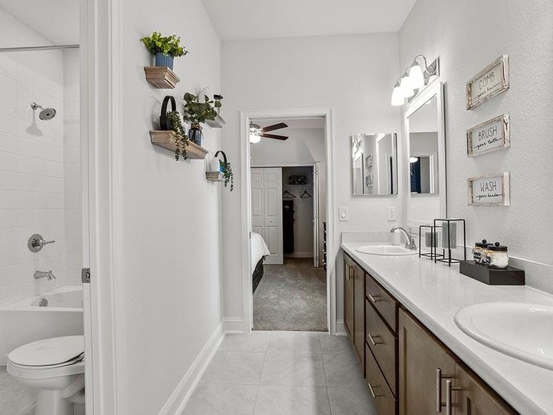 You will appreciate thoughtful design, such as this Jack-and-Jill bath - Waylyn model home in St. Cloud, FL
