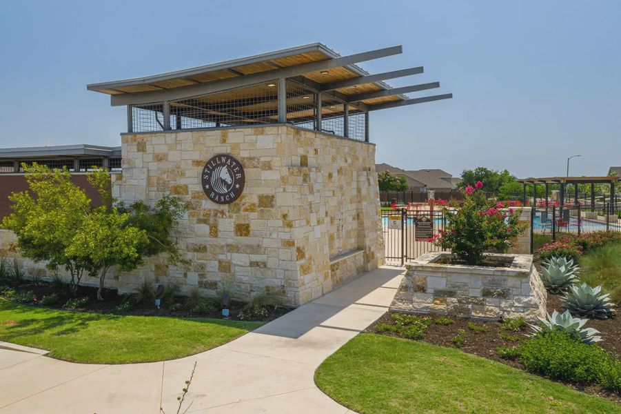 Entrance to the Stillwater Ranch community in San Antonio, TX, featuring signage and landscaping (Image 2). Entrance to the Stillwater Ranch community in San Antonio, TX, featuring signage and landscaping (Image 2).