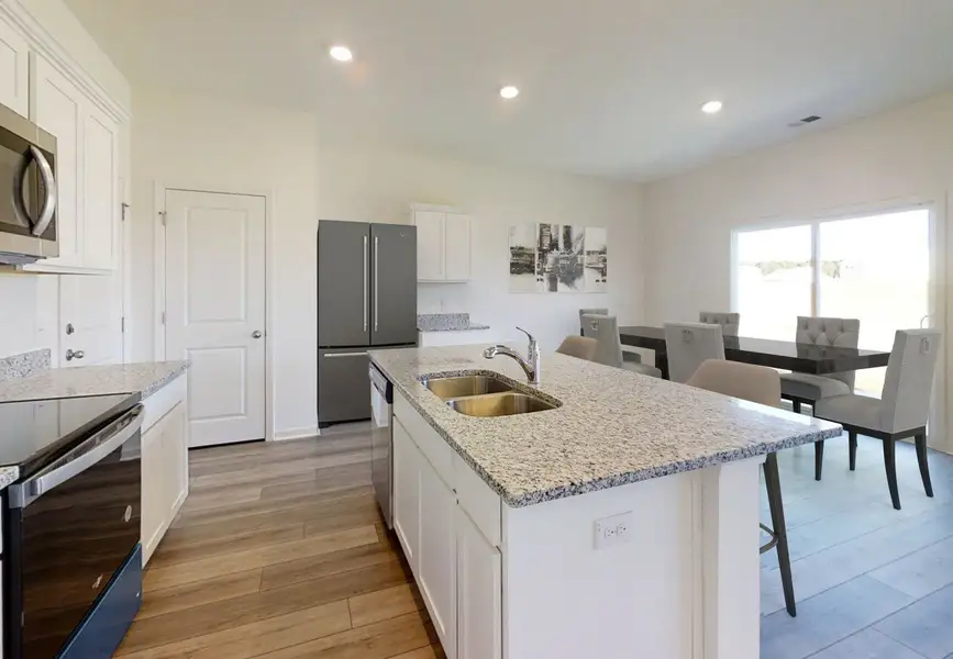 Furnished interior in a model home at The Point in Rolesville (Image 5).
