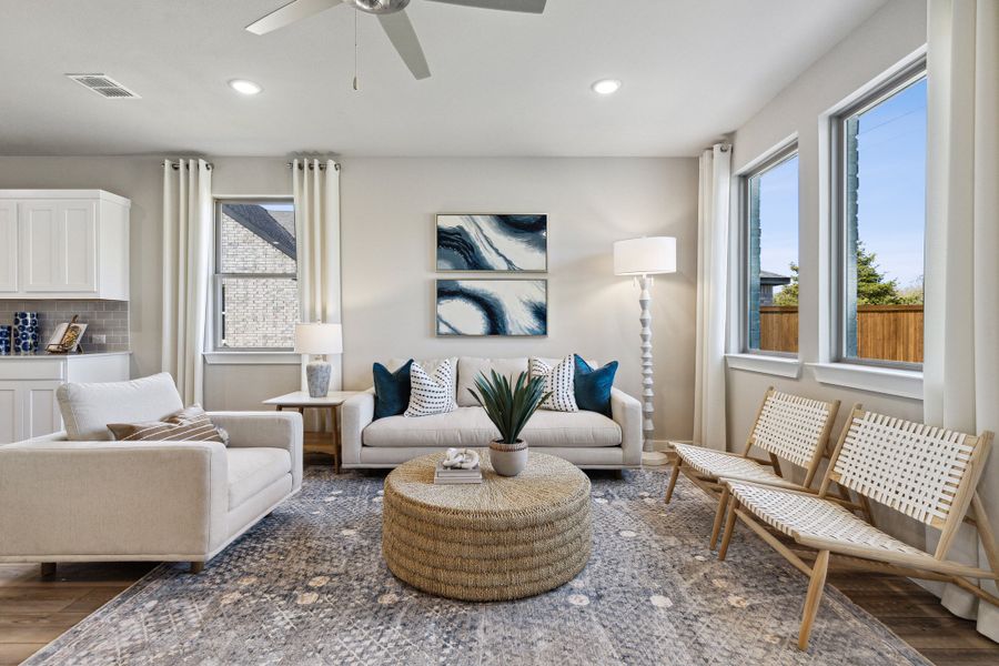Living Room in an Oak Model Home by Trophy Signature Homes