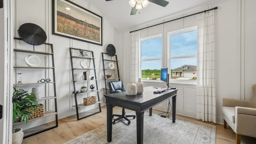 Dedicated home office with custom woodwork wall treatment and elegant workspace design Dedicated home office with custom woodwork wall treatment and elegant workspace design