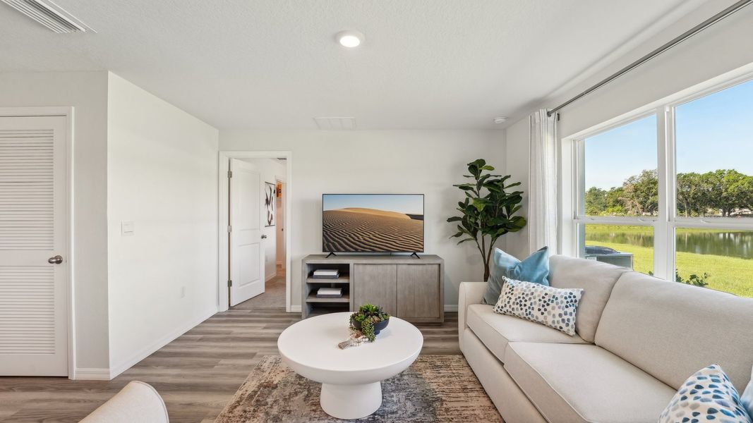 Furnished interior in a model home at Fletcher Trace in Alachua (Image 7).
