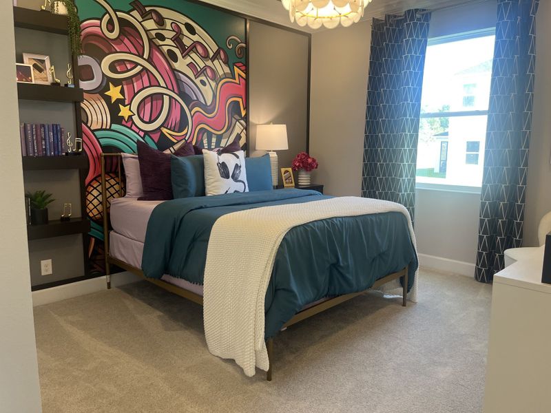 A vibrant bedroom with colorful mural, cozy bed, decorative pillows, and modern shelving. A vibrant bedroom with colorful mural, cozy bed, decorative pillows, and modern shelving.