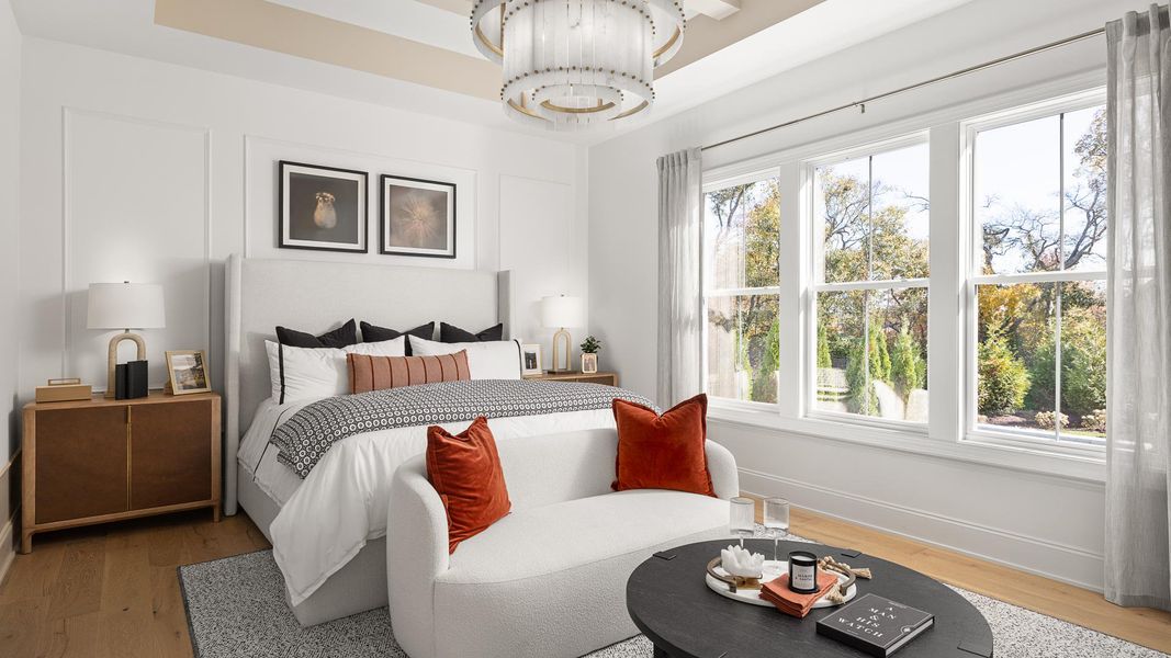 Large primary bedroom with plentiful light