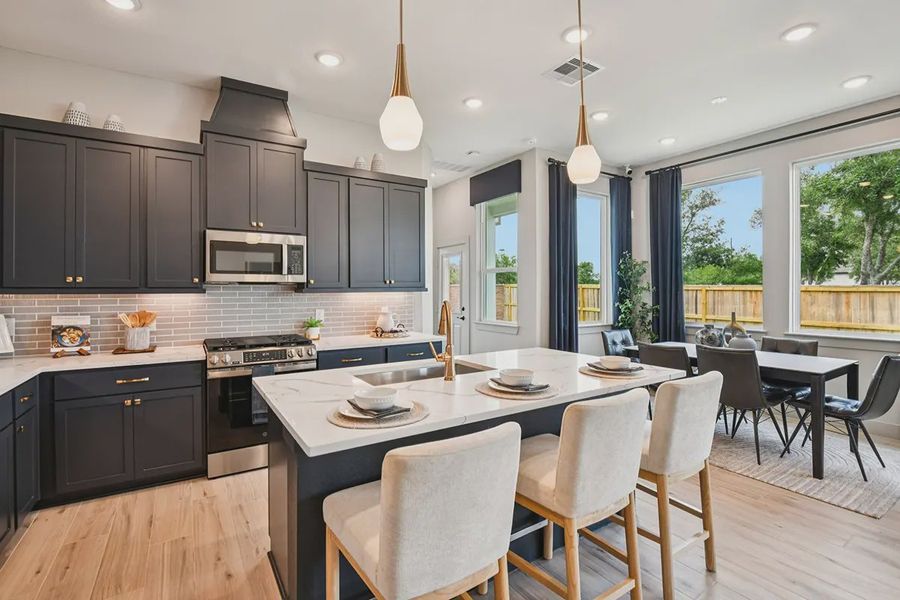 Furnished interior in a model home at Meridiana Chateau in Iowa Colony (Image 7).
