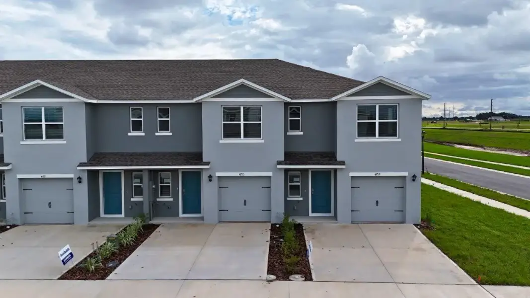 Front exterior of a home in the Annabelle Estates Townhomes community, located in Lake Wales, FL (Image 2). Front exterior of a home in the Annabelle Estates Townhomes community, located in Lake Wales, FL (Image 2).