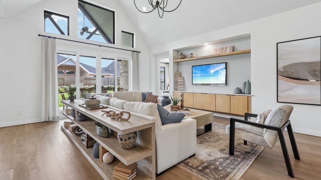 Experience elegant living with vaulted ceilings, chic chandelier, and modern decor in Brookewater.
