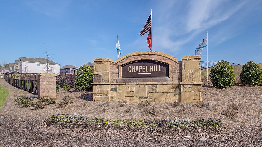 Entrance to the Chapel Hill community in Newnan, GA, featuring signage and landscaping (Image 12). Entrance to the Chapel Hill community in Newnan, GA, featuring signage and landscaping (Image 12).