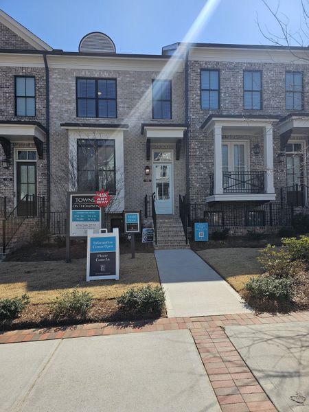Elegant townhomes with classic brick facades in Towns on Thompson by The Providence Group, Alpharetta, GA.