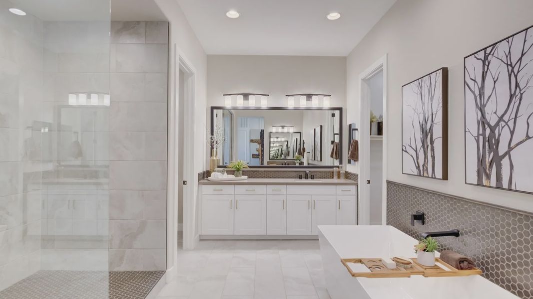 Indulge in a spacious soaking tub, chic hexagonal tile accents, and exquisite finishes in this Arroyo Seco home.