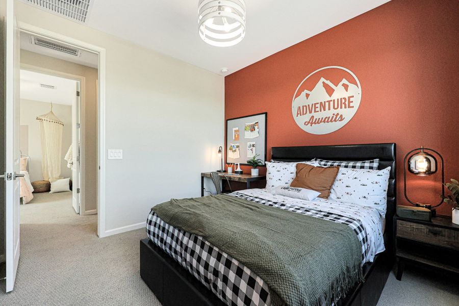 A bedroom with a bed and a lamp. A bedroom with a bed and a lamp.