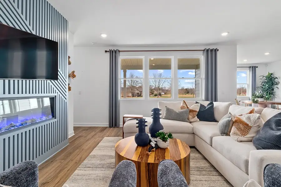 A living room with a fireplace. A living room with a fireplace.