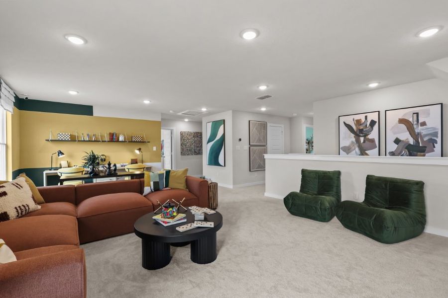 A living room with green couches. A living room with green couches.
