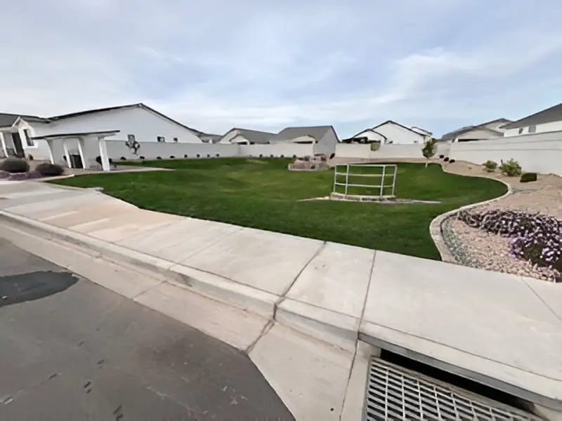 Spacious green lawn with landscaped details at Pecan Cove by Newport Homes in San Tan Valley, AZ. Spacious green lawn with landscaped details at Pecan Cove by Newport Homes in San Tan Valley, AZ.