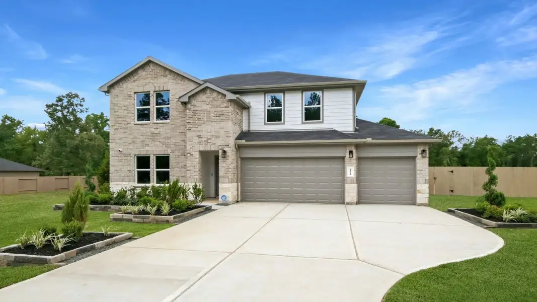 Front exterior of a home in the East Williams Cove community, located in Conroe, TX (Image 1). Front exterior of a home in the East Williams Cove community, located in Conroe, TX (Image 1).
