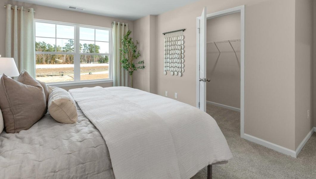 Furnished interior in a model home at Waterside Townhomes in Surf City (Image 18).