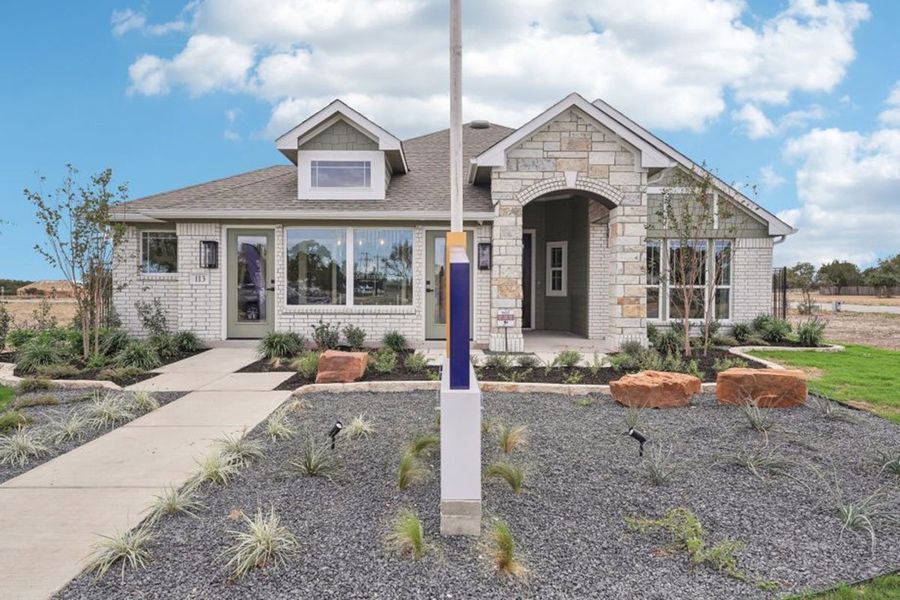 Front exterior of a home in the Grande Estates community, located in Bertram, TX (Image 3).