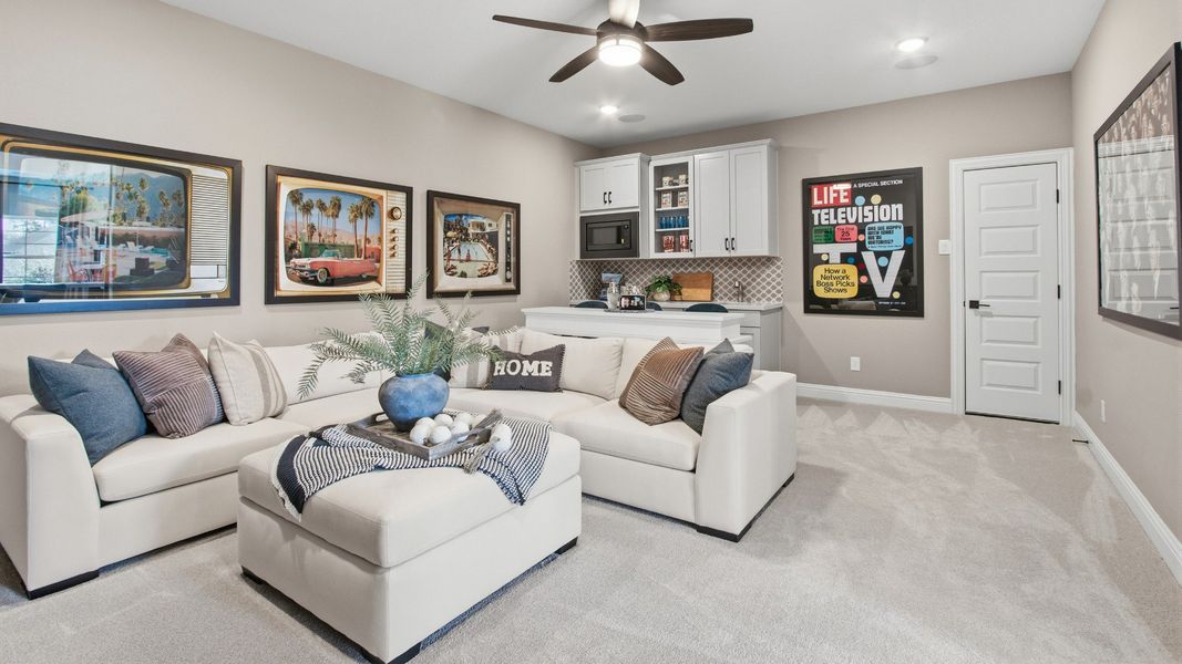 Elegant living space in Mostyn Manor Reserve featuring custom cabinetry and chic design.