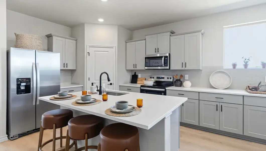 Furnished interior in a model home at The Woodlands at Medina Hills in Mico (Image 30).
