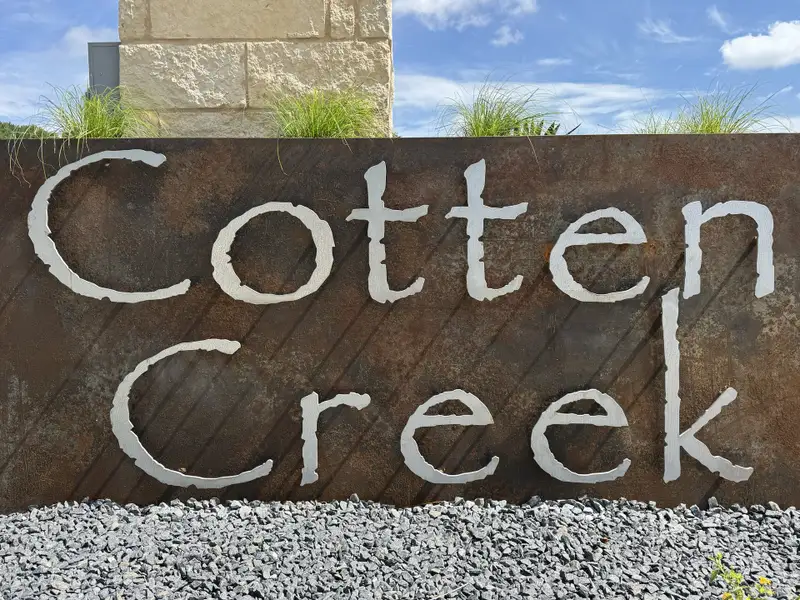 Entrance to the Cotten Creek community in Azle, TX, featuring signage and landscaping (Image 3). Entrance to the Cotten Creek community in Azle, TX, featuring signage and landscaping (Image 3).