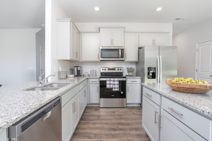 Furnished interior in a model home at Steeplegate Village in Trinity (Image 9).