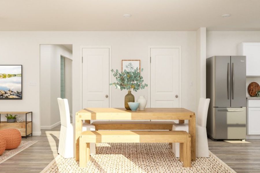 A living room with a table and chairs. A living room with a table and chairs.