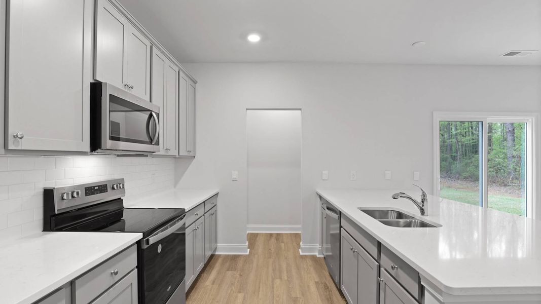 Furnished interior in a model home at Rivers Reach in Yemassee (Image 9).