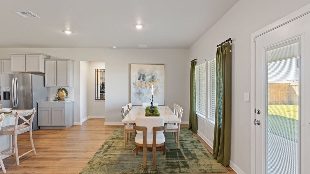 Furnished interior in a model home at King's Landing in Corpus Christi (Image 5).