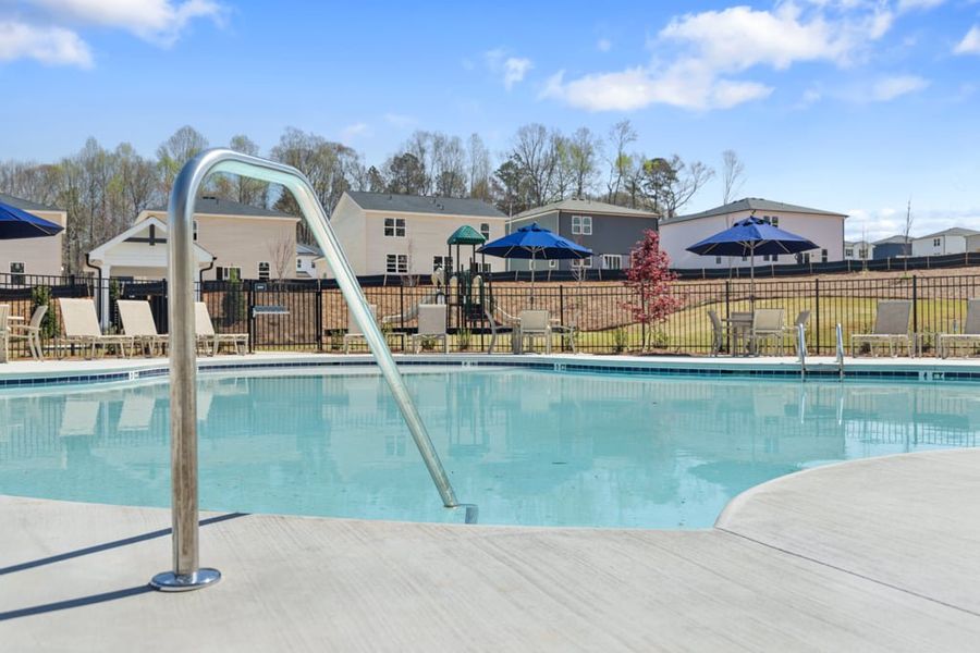 A pool with a slide in it. A pool with a slide in it.
