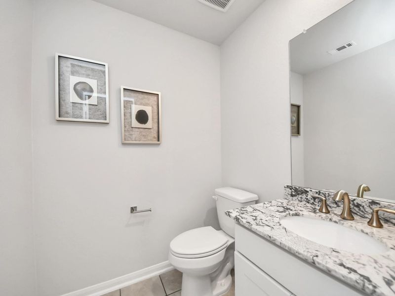 Furnished interior in a model home at Sunterra in Katy (Image 26).
