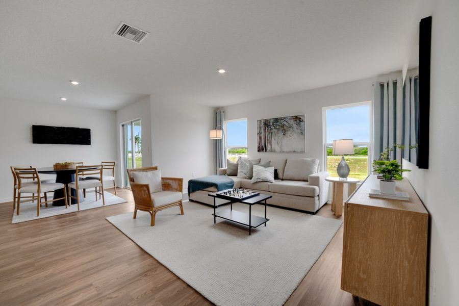 A living room with a wood floor.