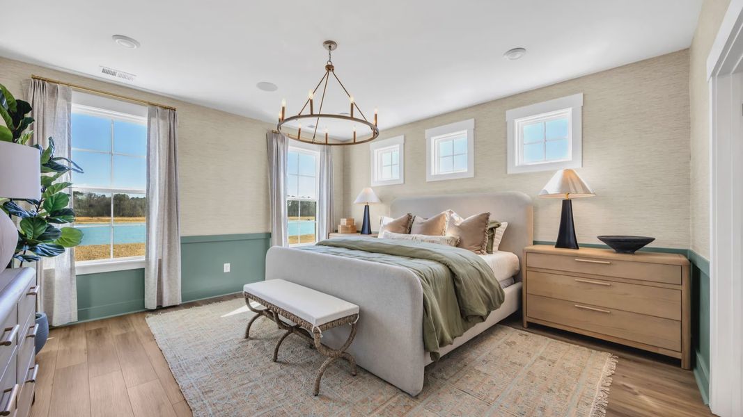 premium primary bedroom Exterior house in Chestnut Farms in by DRB homes offering wood floors and lots of natural light