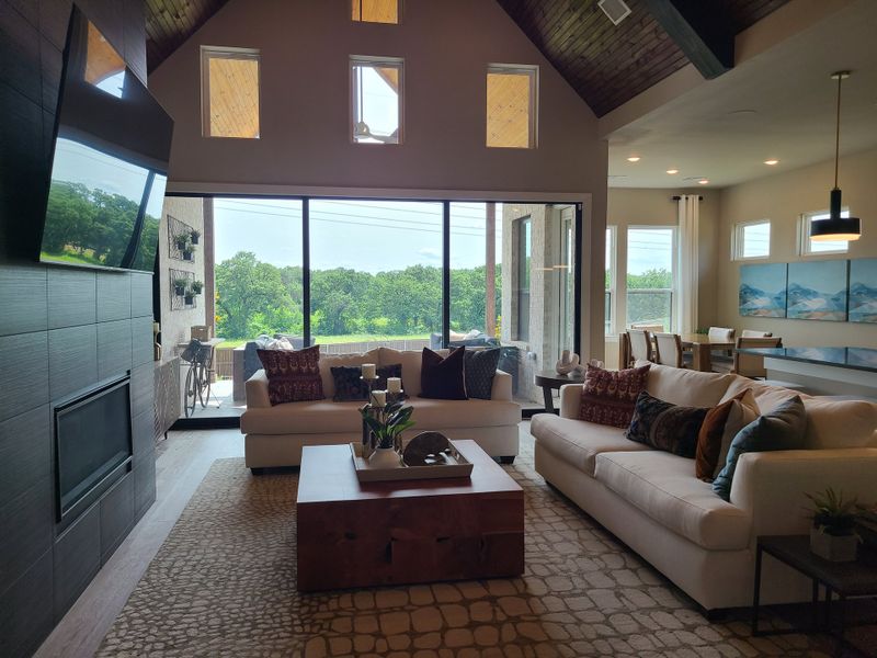 A cozy living area with plush sofas, large windows, and elegant decor. Scenic views create a serene ambiance. A cozy living area with plush sofas, large windows, and elegant decor. Scenic views create a serene ambiance.